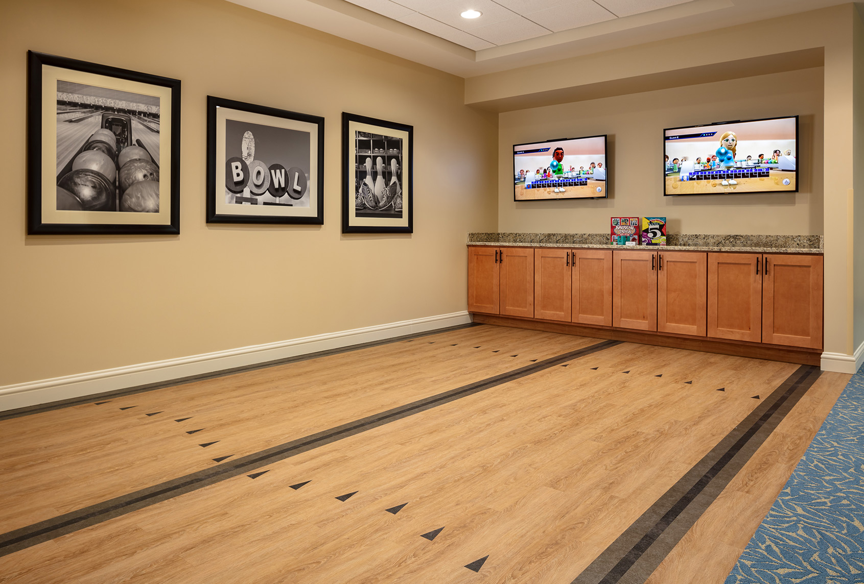 Residents' game room with puzzles, board games, and a library